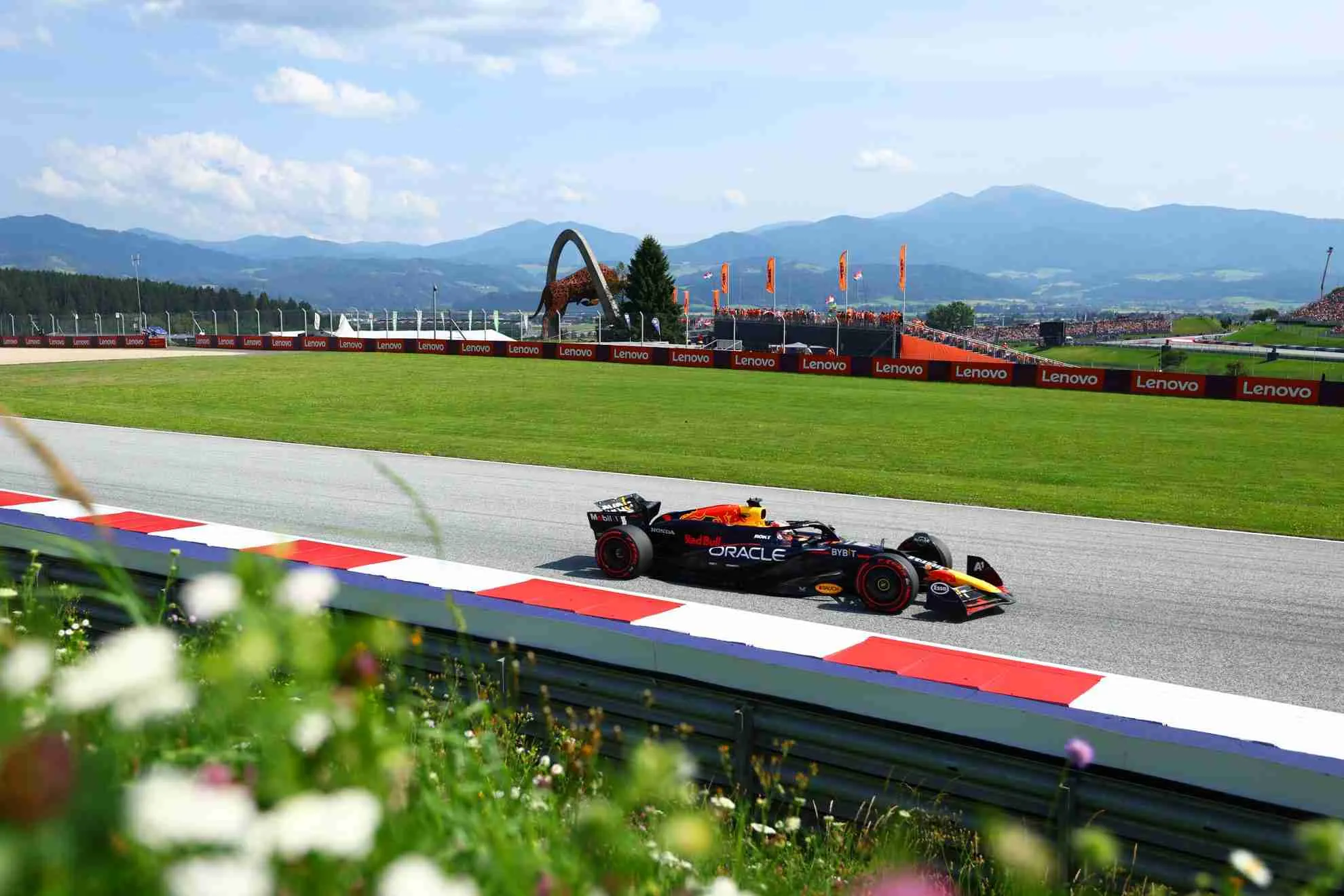 An F1 Red Bull car passes through a corner at the Red Bull Ring