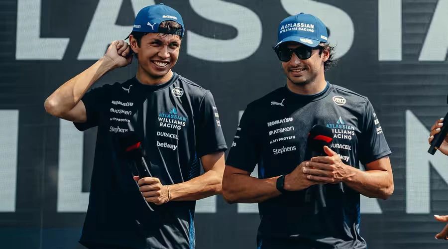 Alex Albon and Carlos Sainz smile during an interview for the Williams team