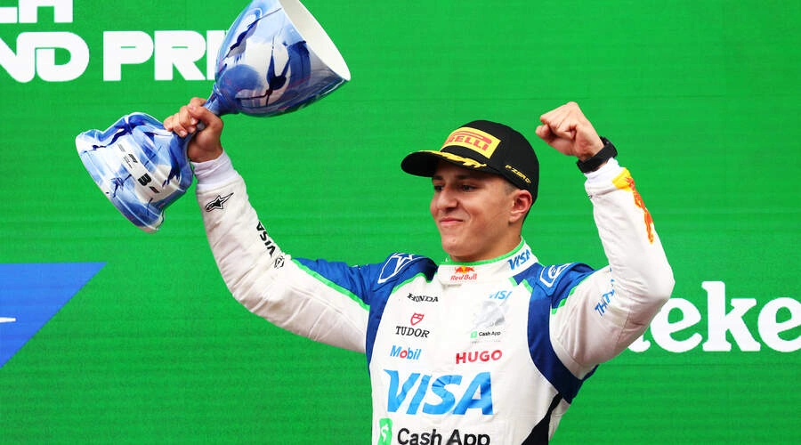 Isack Hadjar celebrates his first podium during the 2025 Dutch GP
